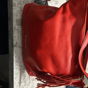 Beautiful red Michael Kors purse lightly used